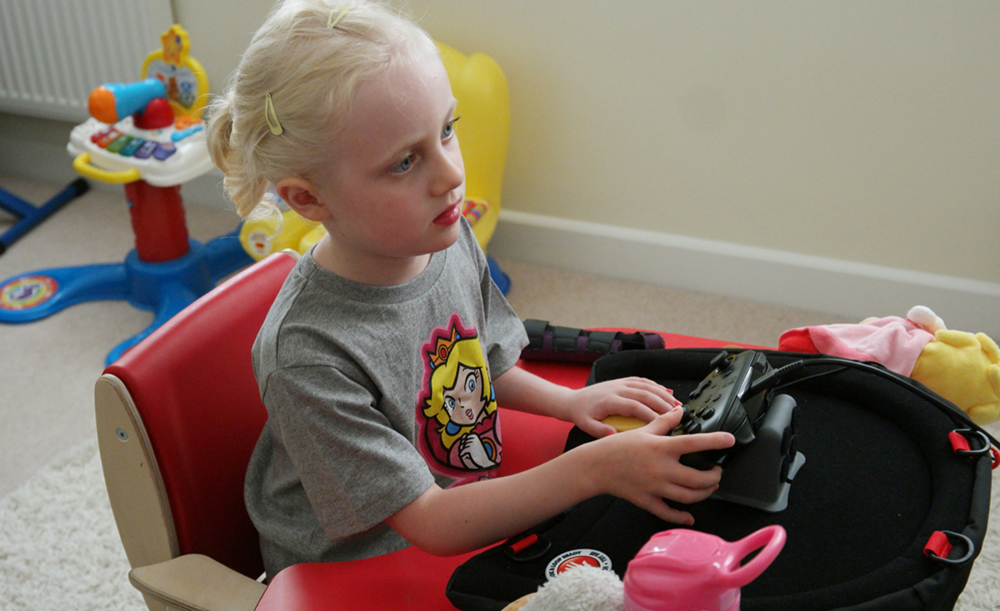 Seated girl playing games