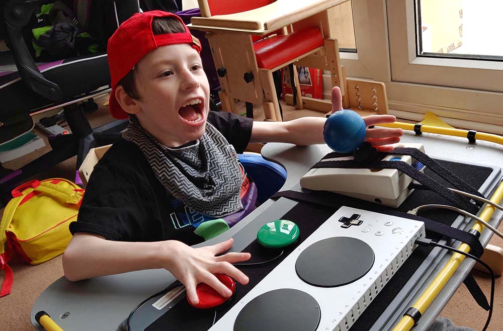 Smiling boy playing video games