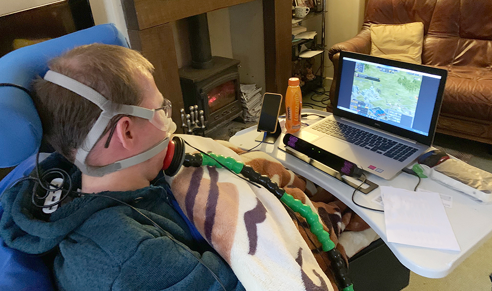 Seated man playing games