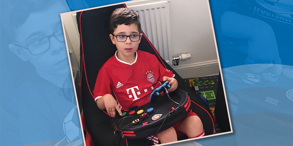 Seated boy playing video games