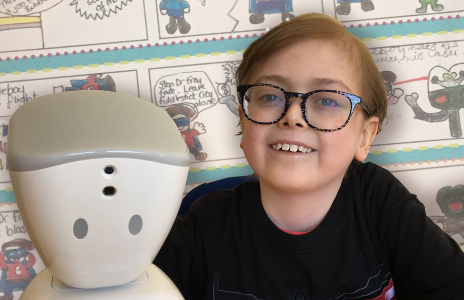 Close up of smiling boy alongside robot