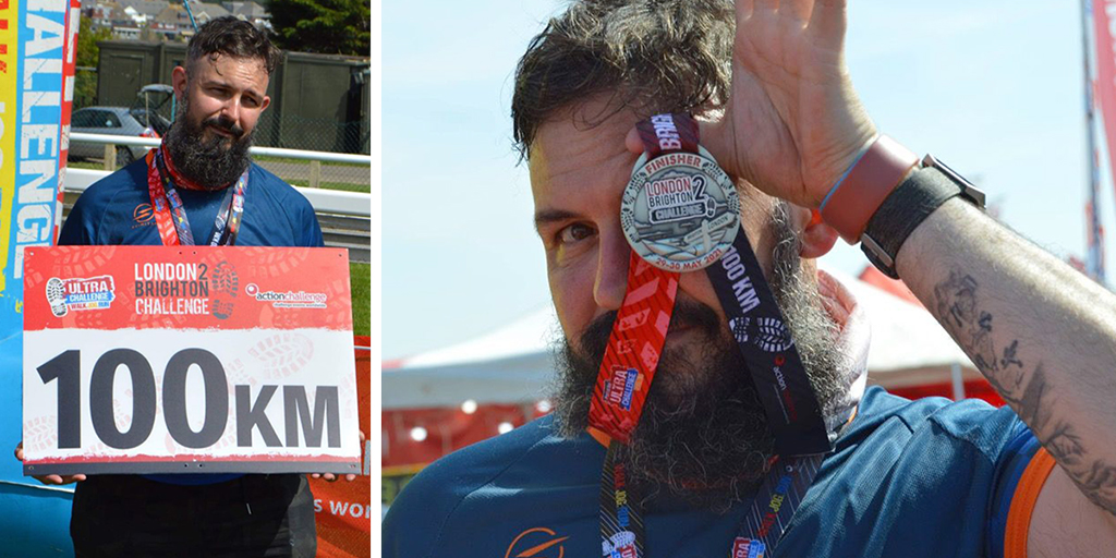 Bearded walker holding up a medal