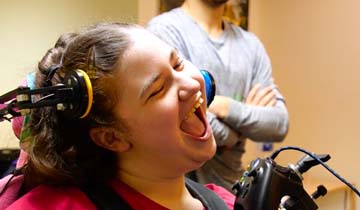 Laughing girl in wheelchair