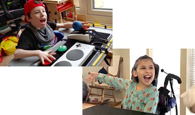 Smiling young boy and girl seated and playing games