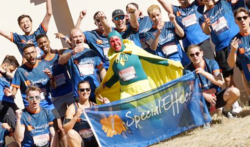 Close up of group of runners with flag