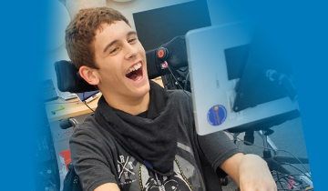 Smiling young man looking at screen