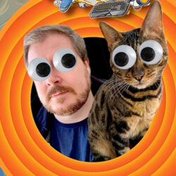 The faces of a bearded man and his cat, both with added cartoon googly eyes