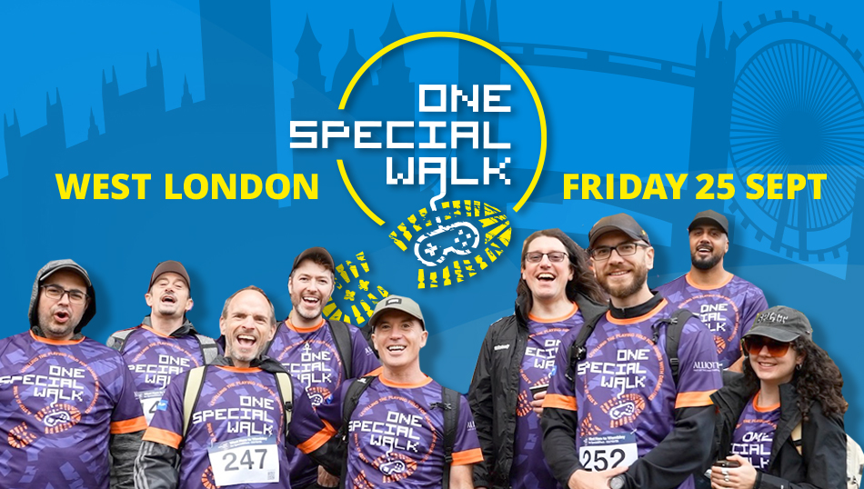 Group of smiling walkers beneath the event logo and date - 25 September