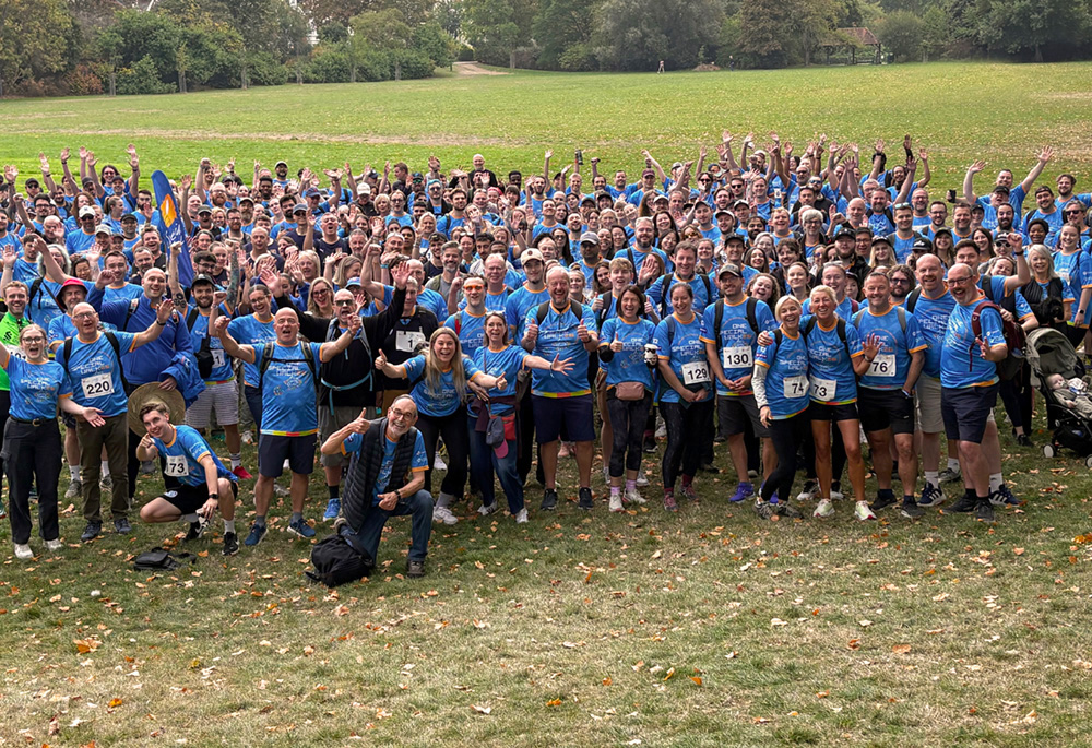 Hundreds of runners cheer before the start of the walk
